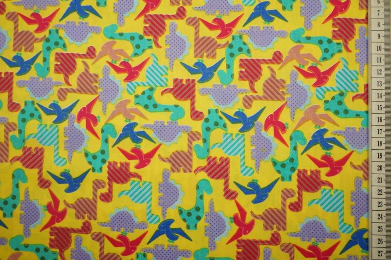 Bawełna drukowana w kolorze żółtym w dinozaury